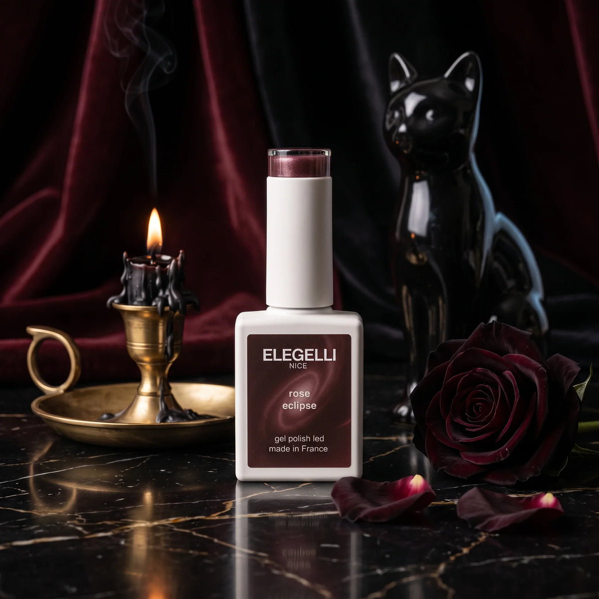 Elegelli cat eye gel polish Rose Eclipse with a black ceramic cat and a black rose