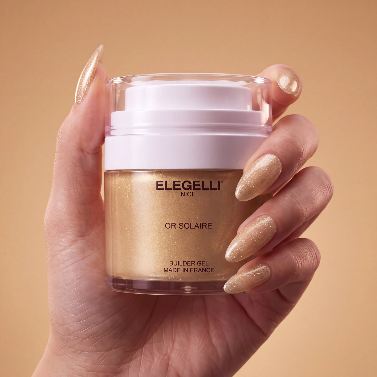 Builder Gel B030 Or Solaire Elegelli - jar held in hand with Or Solaire nails