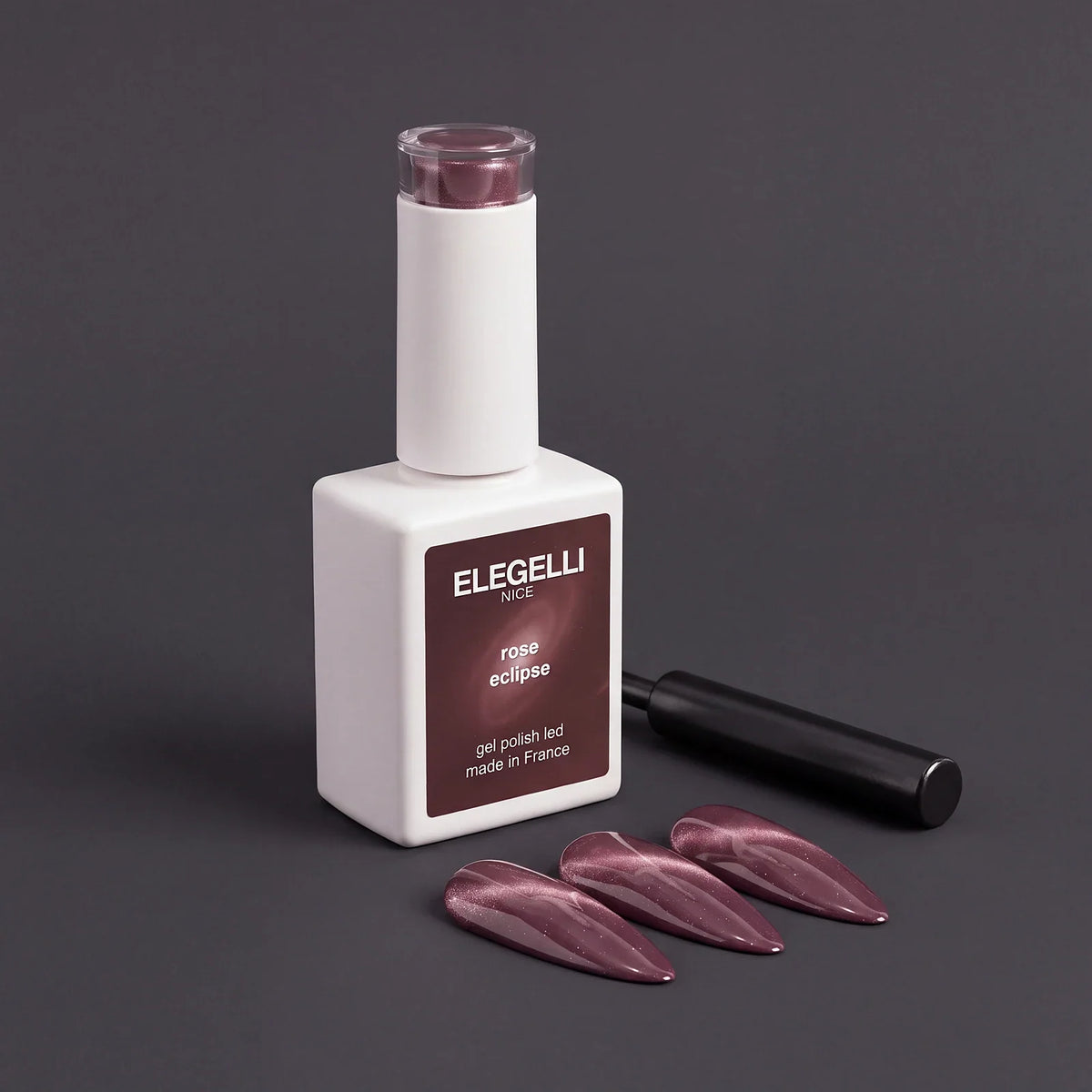 Elegelli Rose Eclipse cat eye gel polish with cat eye nail tips and a nail magnet