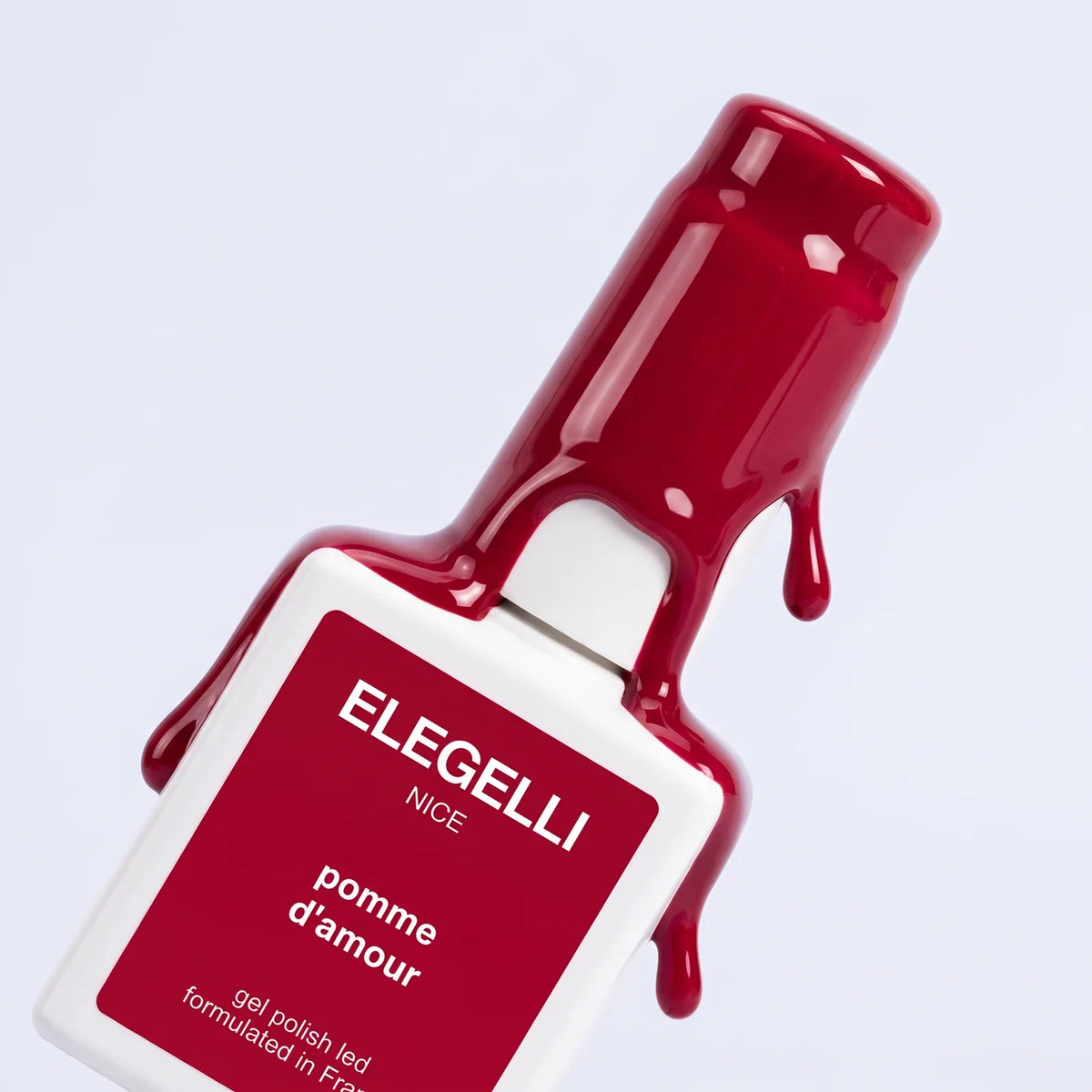 Elegelli Pomme d'Amour red gel polish bottle with glossy red gel dripping from the cap