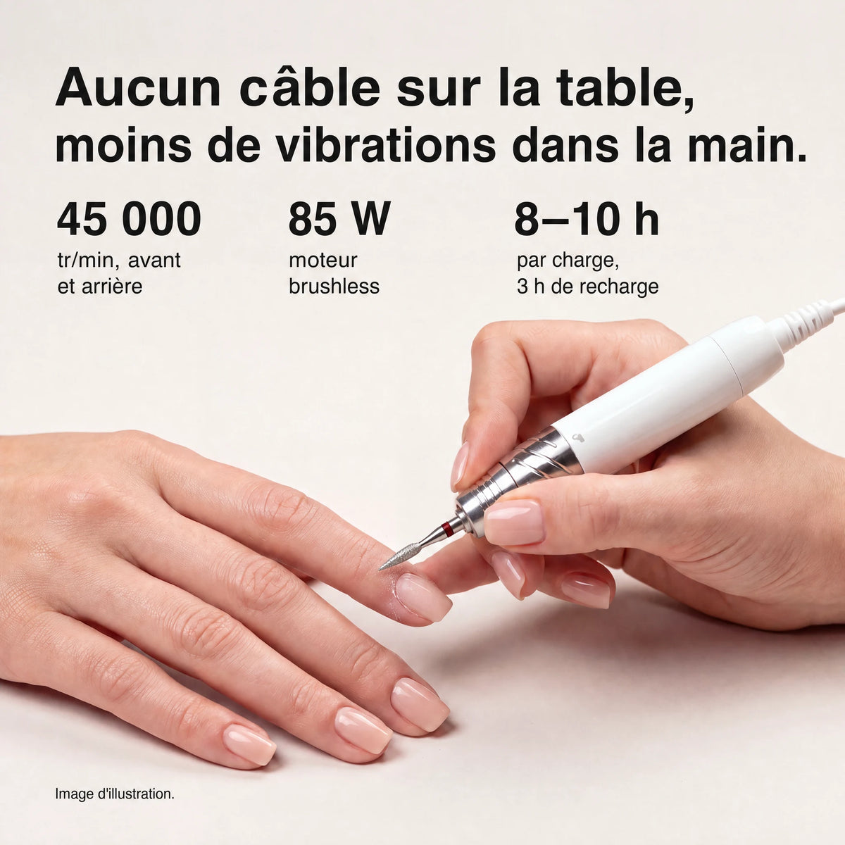 A white and silver electric nail drill being used on a person's fingernail, with marketing text above stating no cable on the table, no vibration in the hand, 45,000 RPM forward and reverse, 85 W brushless motor, and 8-10 h per charge, 3 h to recharge.