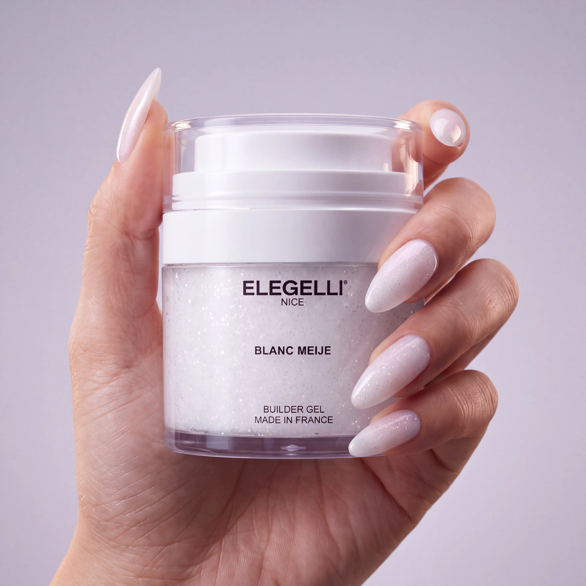 Builder Gel B027 Blanc Meije Elegelli - jar held in hand with Blanc Meije nails