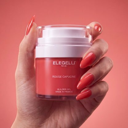 Builder Gel B021 Rouge Capucine Elegelli - jar held in hand with Rouge Capucine nails